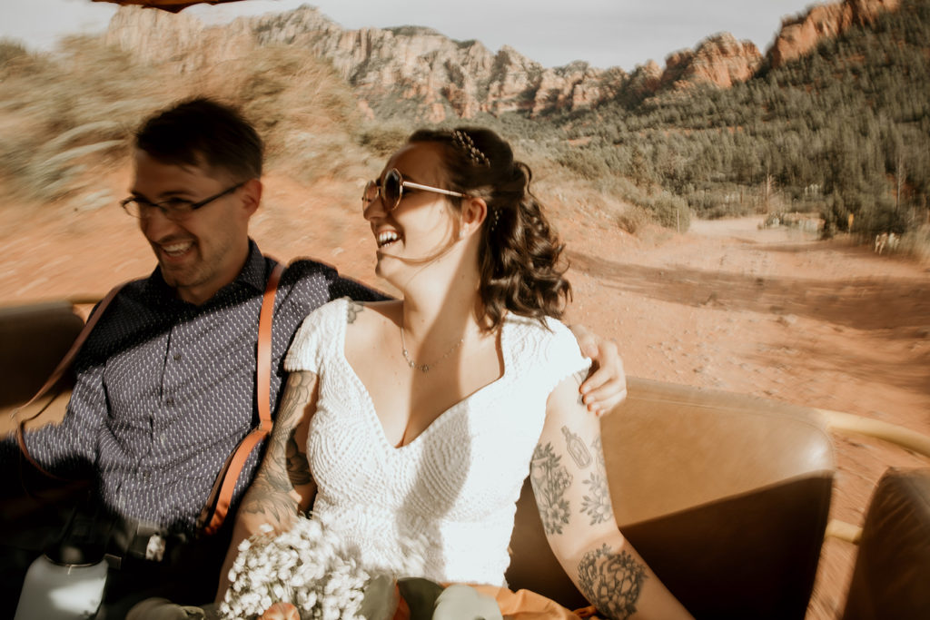 Bride and groom on a jeep ride on their elopement day. 