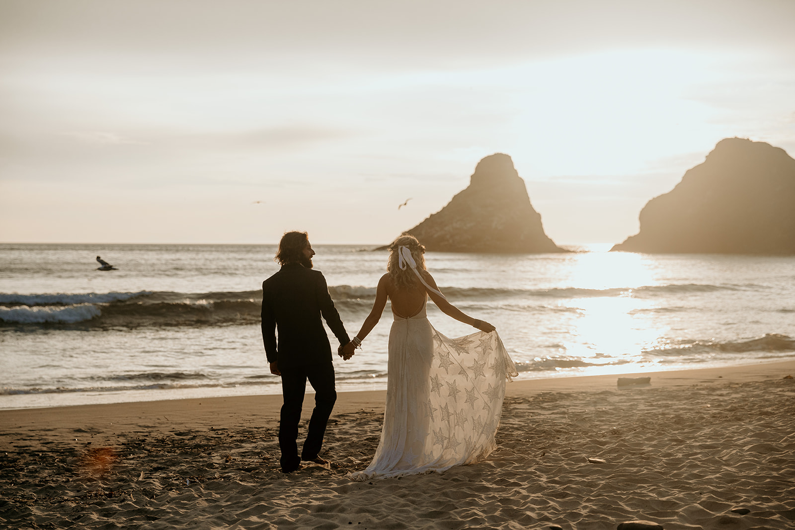 Bride and groom at their elopement on the Oregon coast during sunset.