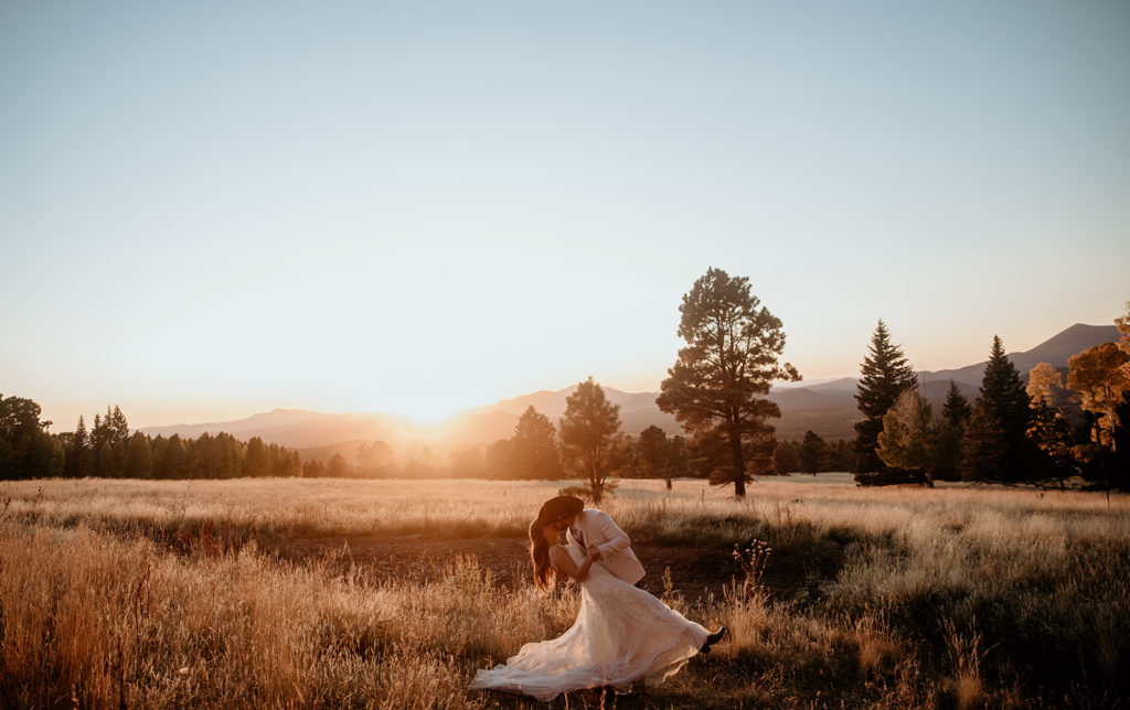 Bride and groom kissing during sunset in Flagstaff, Arizona