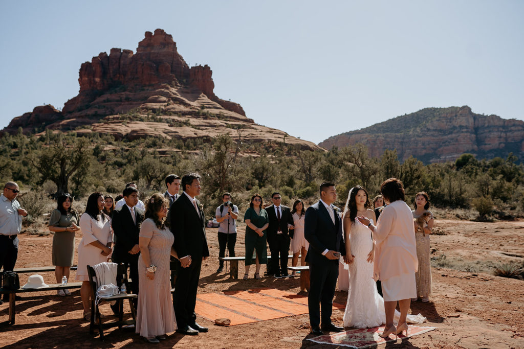 Elopement ceremony with family and friends in Sedona, Arizona desert. 