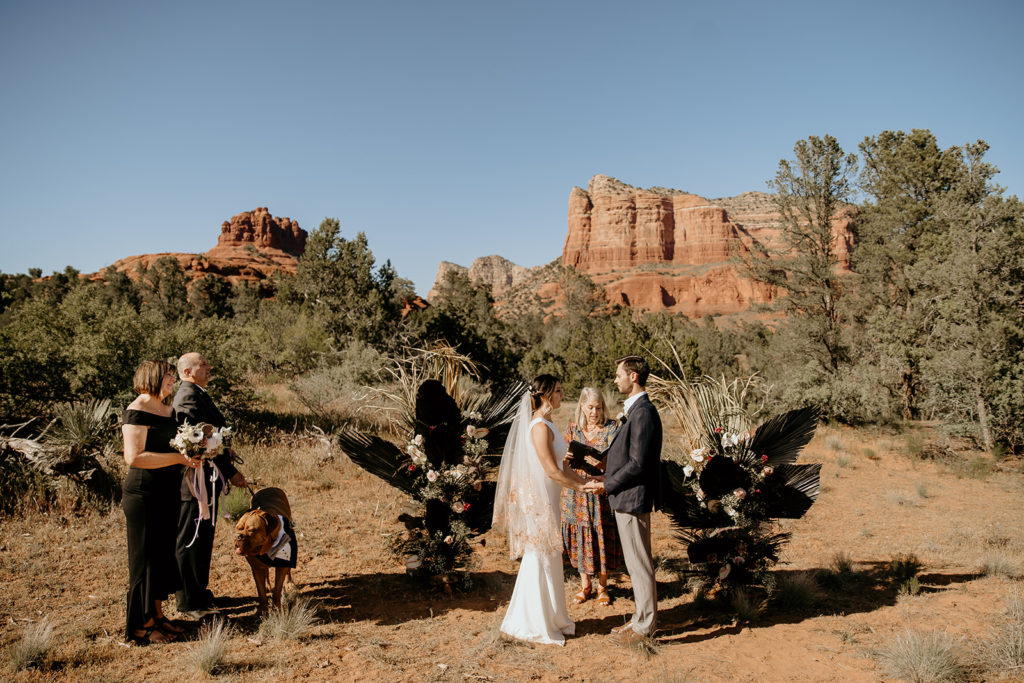 Bride and groom with their family at their elopement in the red rocks of sedona, arizona