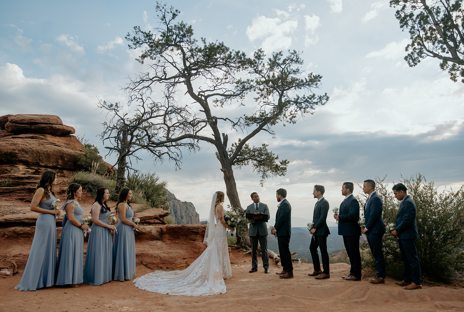 Bride and groom with their friends and family at their elopement in Sedona, arizona