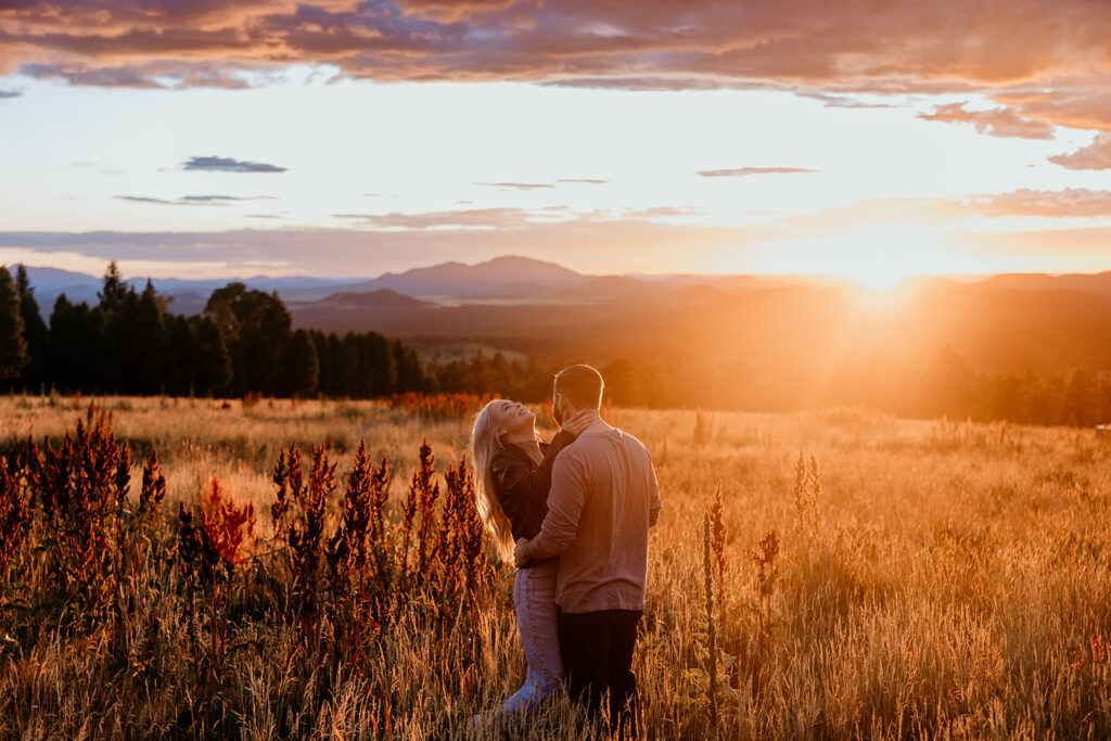 couple laughing at their engagement session in flagstaff
