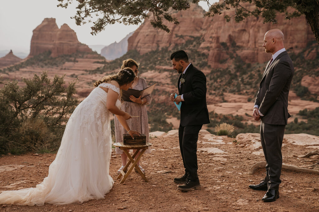 bride and groom creating time capsule at elopement ceremony