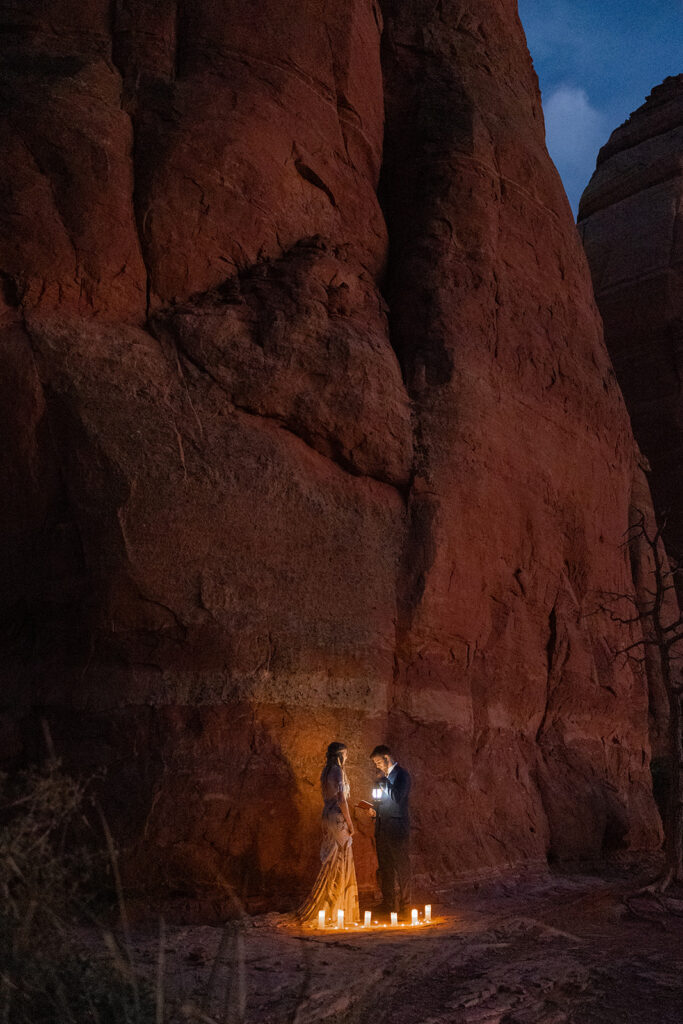 bride and groom having a candlelit elopement ceremony in sedona 