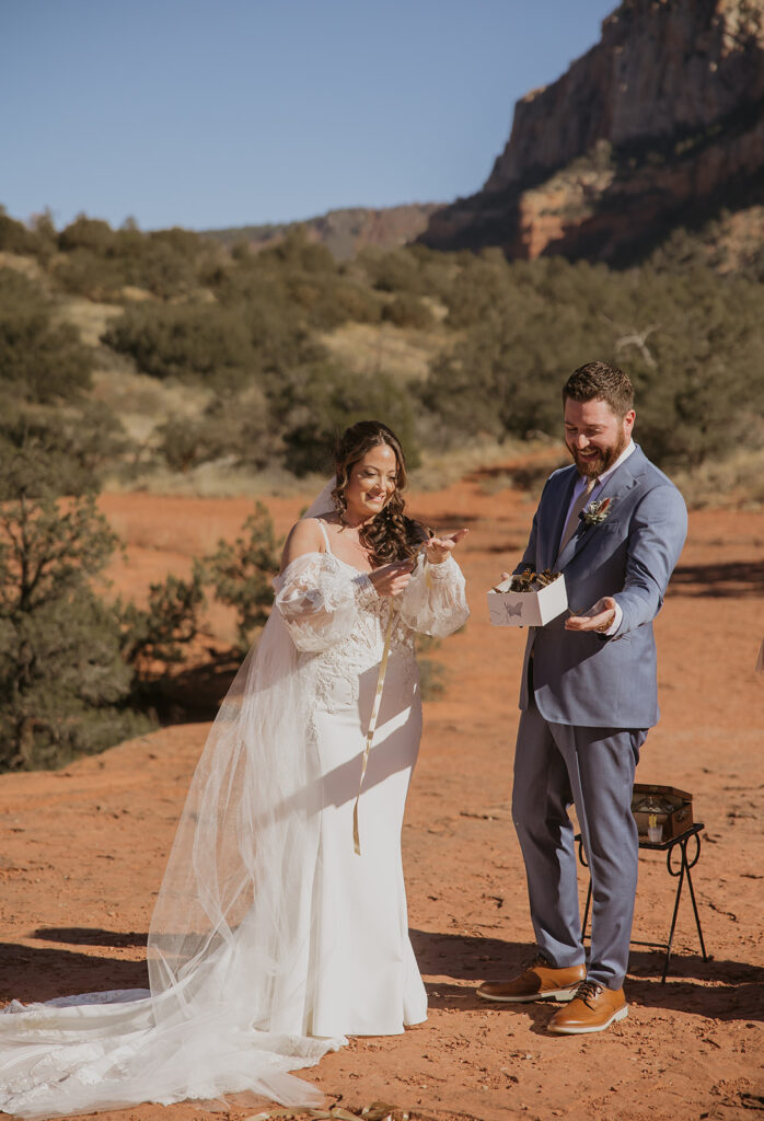 bride and groom releasing butterflies at their elopement ceremony